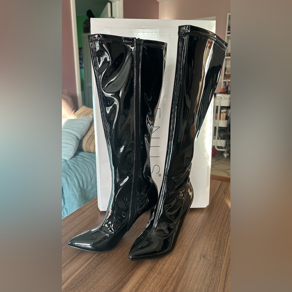 Brand new, Size 8, knee-high pointy boots.